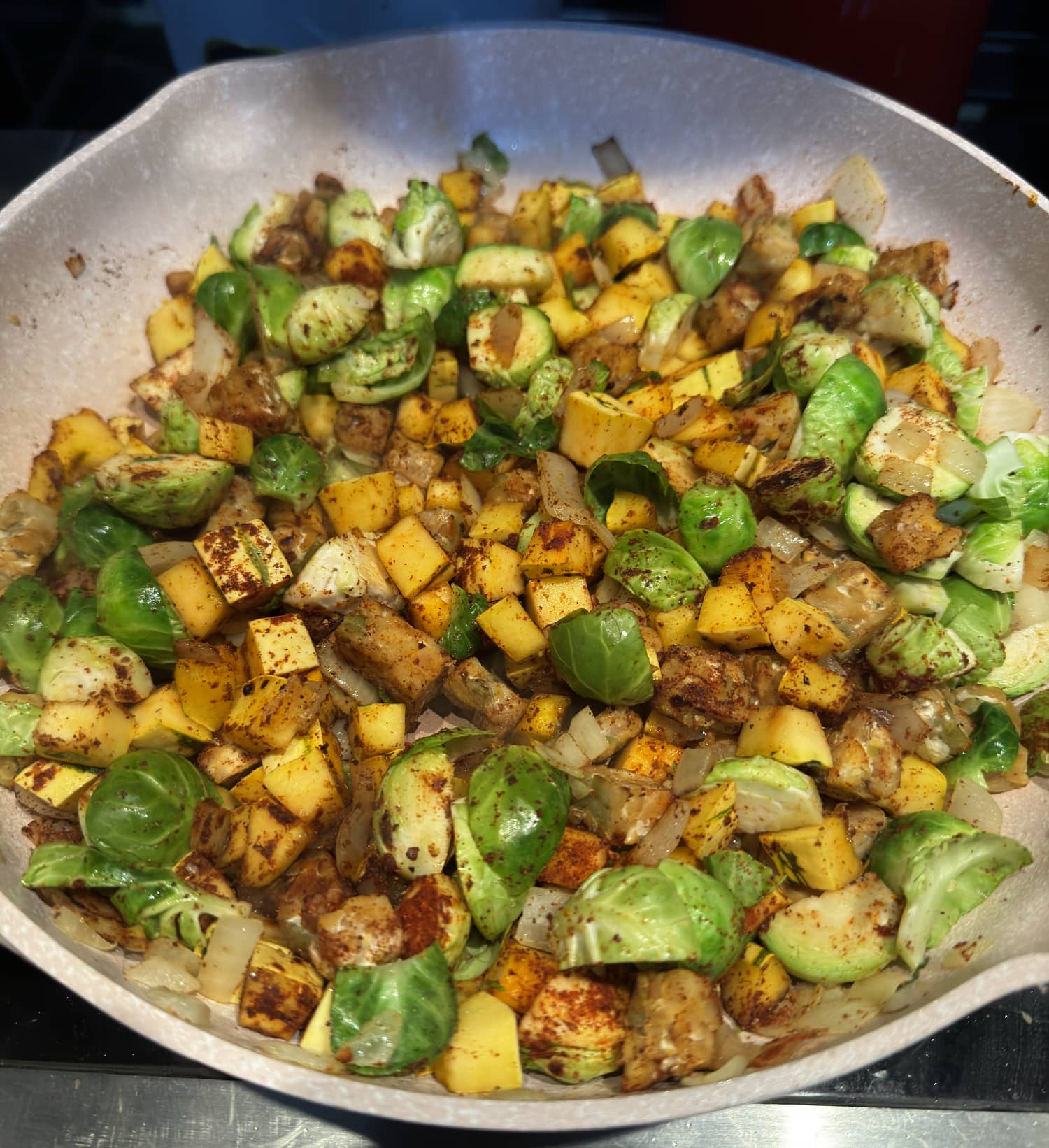 all tempeh delicata hash ingredients in a skillet.