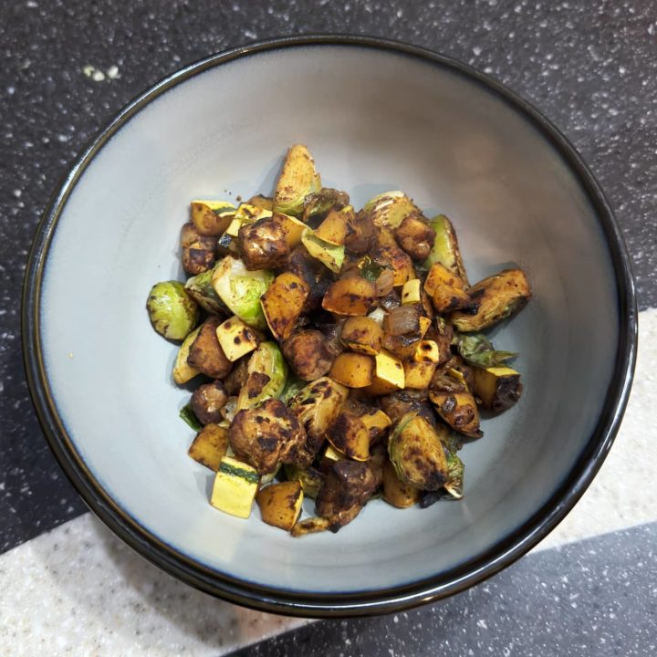 a serving of tempeh delicata hash in a bowl.