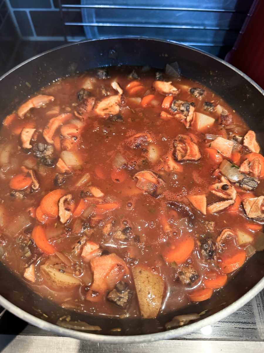 hearty pantry stew simmering in pot.