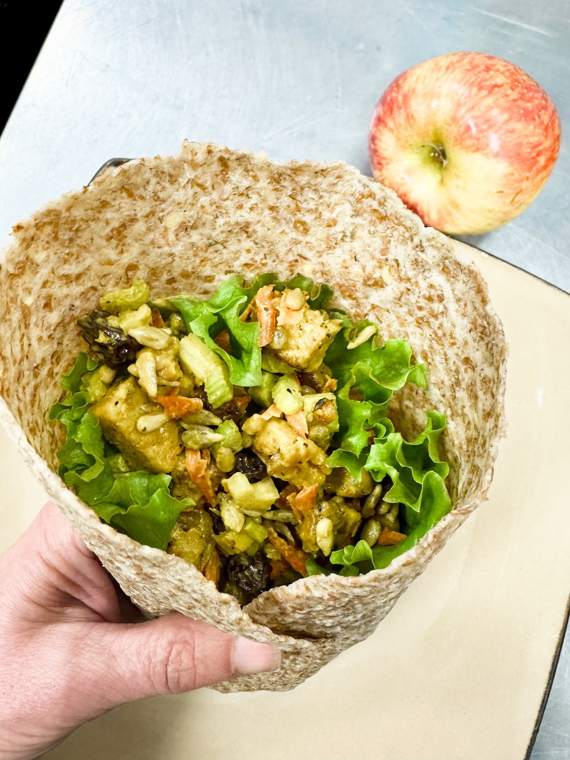 curried tempeh salad on a wrap.